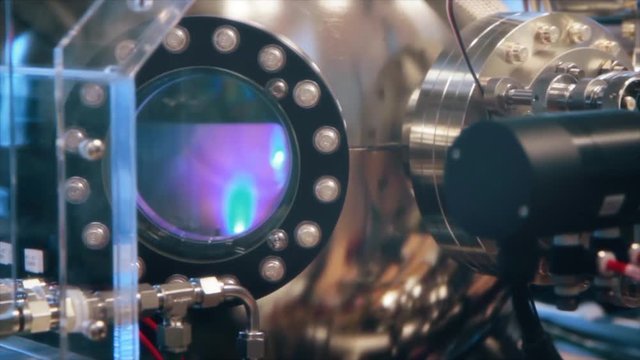 Laser equipment in use in a college science experiment while research is being conducted. Higher education, technology and engineering studies at a university. Large modern science equipment.