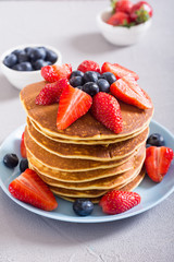 Tasty pancakes with blueberry and strawberry