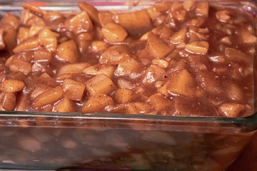 glass bowl full of chunky apple sauce on a holiday