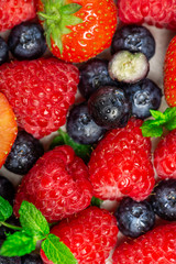 Fototapeta na wymiar Fresh summer berries such as blueberries, strawberries, raspberries, top view