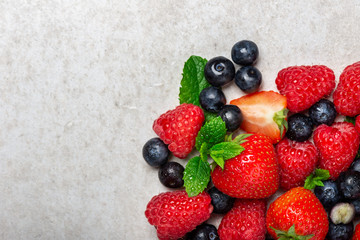 Fresh summer berries such as blueberries, strawberries, raspberries, top view