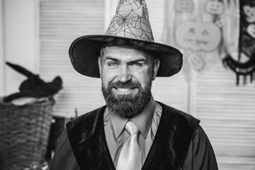 Happy wizard. The man in the hat of the witch. Halloween party. Bearded man on October 31. Good...