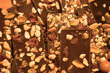 pile of chocolate candy with nuts and fruit