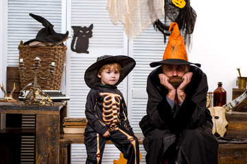 Father and son. Halloween Preparing for a party. Pumpkin. Children and holidays.