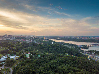 Panoramic view of Kyiv from the sky. Sunset over summer Kiev. Filmed on drone. Aerial view