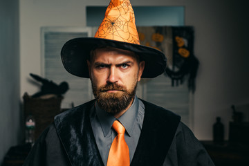 Halloween. Bearded man. Father plays wizard. Fantasy. Autumn. Halloween party. 31 october. Magic hat