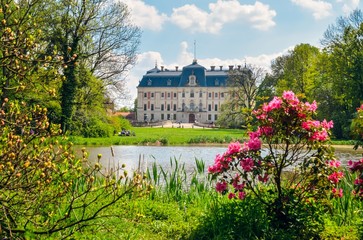 Beautiful historic castle in colorful spring scenery. Neo baroque castle in a park in Pszczyna in...