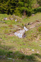 Panorama of untouched landscapes in the Austrian Alps with river, streams and waterfalls