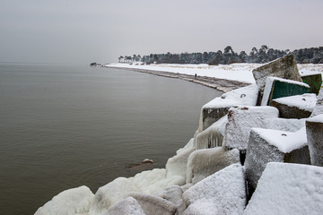 pieces of frozen ice in the lake in dim winter day