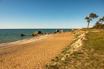 large rock in sand in countryside