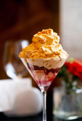 Delicious sweet dessert with cream and raspberry