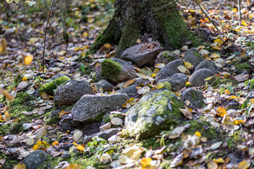 large rock in sand in countryside