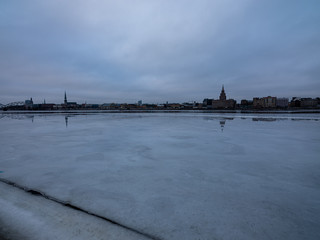 pieces of frozen ice in the lake in dim winter day
