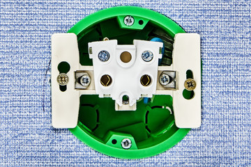 Disassembled electrical outlet without top panel.