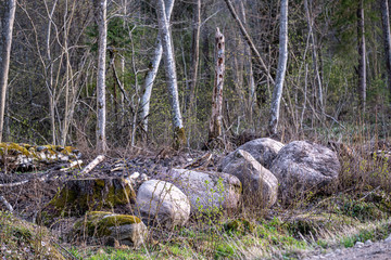 large rock in sand in countryside