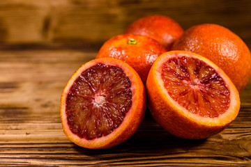 Ripe sicilian oranges on a wooden table