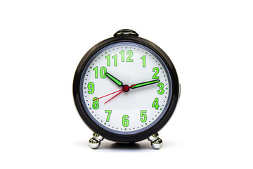 Round alarm clock on an isolated white background