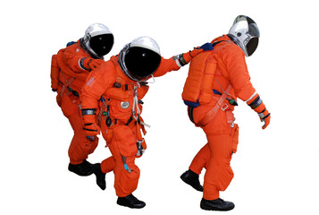 Three Walking astronauts in the Yellow space suite isolated on white background. Science concept wallpaper. Elements of this image were furnished by NASA.