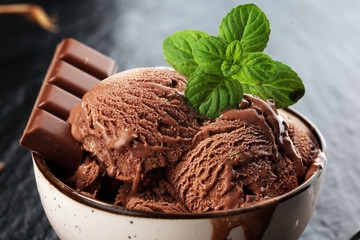 Chocolate coffee ice cream ball in a bowl. ice cream scoop