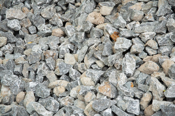 small stones on the heap. Crushed stone Texture of gray stone.