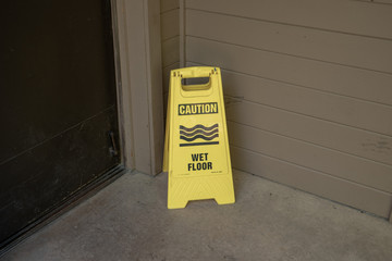 caution wet floor sign has been displayed to avoid an accident