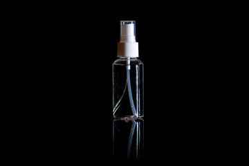 Glass cosmetic bottle isolated on black. Branding mock up.