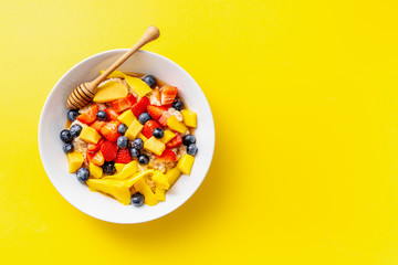 Homemade porridge served with fruits and berries