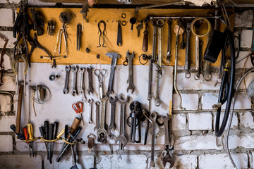 A set of keys and tools for repair hang on the wall