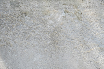 Cement wall with shallow cracks.  Background in the form of an old wall with cracks.