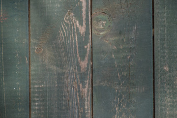 Wooden background of old boards painted with paint.  Old wooden fence
