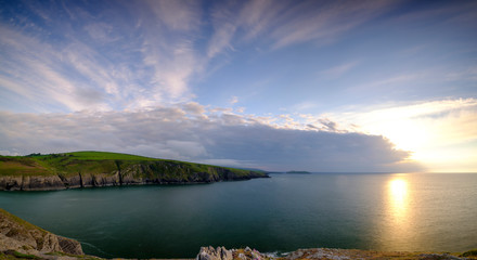 Evening light on the Ceredigion cliffs and Cardigan Island from Mwnt, Wales