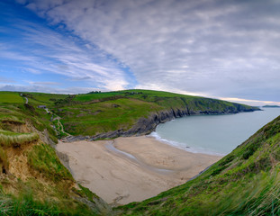 Evening light on the Ceredigion cliffs and Cardigan Island from Mwnt, Wales