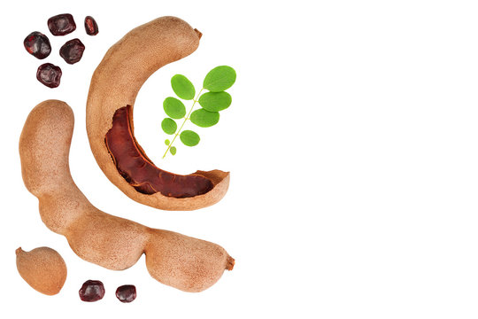 Tamarind fruit with leaf and seed isolated on white background with copy space for your text. Top view. Flat lay