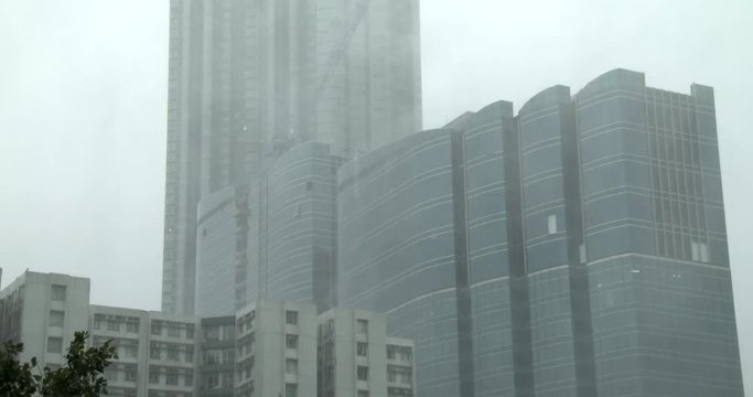 Torrential Rain Sheets Past High Rise Sky Scrapers During Tropical Storm - Hato