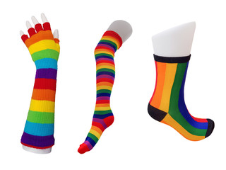 Rainbow socks, stockings and gloves on white background