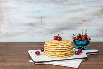 Sweet Homemade Stack of Pancakes with cherries