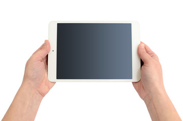 Hands holding a gadget on a white background. Tablet computer, wireless device.