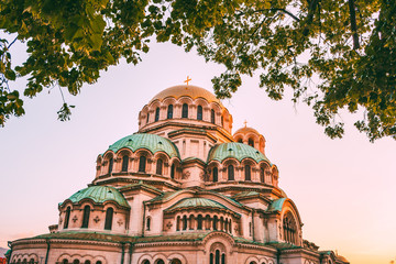 alexander nevsky cathedral and trees in sofia bulgaria during sunset