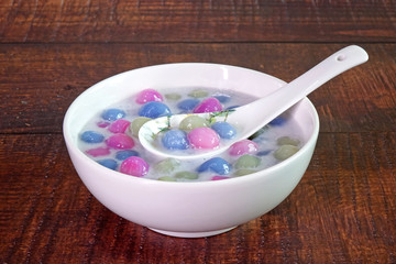 Thai dessert : Thai glutinous rice balls in creamy coconut milk syrup ( Bua Loi, or Bua Loy) Selective focus with copy space.