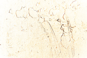 Vintage yellow background. Rough painted wall of aspen gold color. Imperfect plane of golden colored. Uneven old decorative toned backdrop of yellow tint. Texture of gold hue. Ornamental stony surface