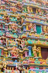 Fototapeta na wymiar Carved images on the gopura (tower) of the Sri Maha Mariamman Temple, a Tamil Hindi temple located in Silom road, Bangkok, Thailand