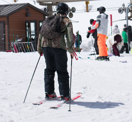 Skier riding to the ski lift
