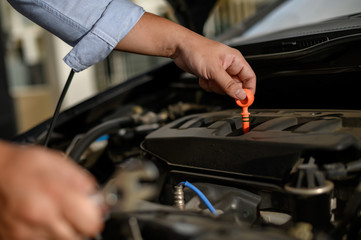 Repair service car Auto mechanic working in garage car mechanic with wrench in garage