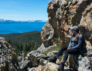 Woman on a Tahoe Mountain Top Looking onto the lake - Vacation Motif