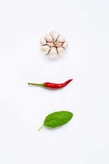 Ingredients herb and spice, holy basil, chili and garlic on white background. Healthy eating concept