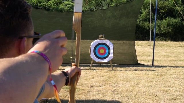 man misses the bullseye on a sunny day