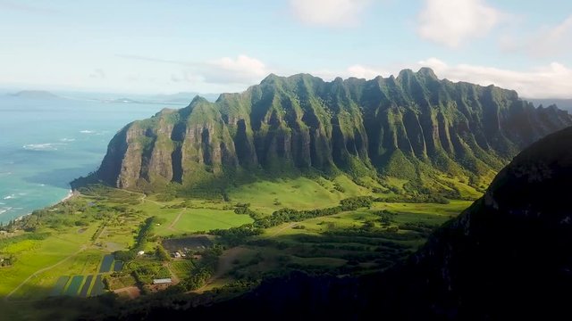 Drone shot panning and revealing Kualoa Mountain Range (Jurassic Park)