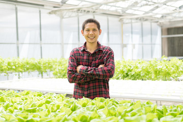 Portrait of Asian farmer in hydroponics vegetables farm