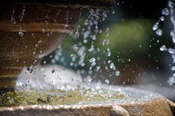 Falling water droplets from a artificial fountain