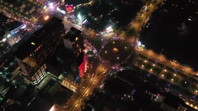 Aerial: Downtown Phnom Penh  business district at night . Iconic feature of the Phnompenh city center that for many building,  at Koh Pich